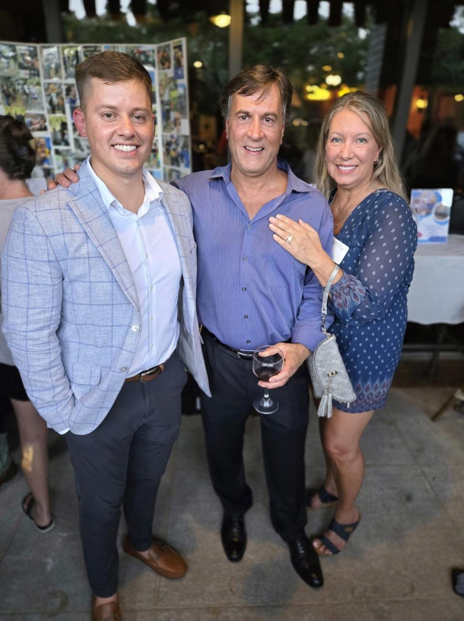 Three guests smiling at a Networking To Help Children social
